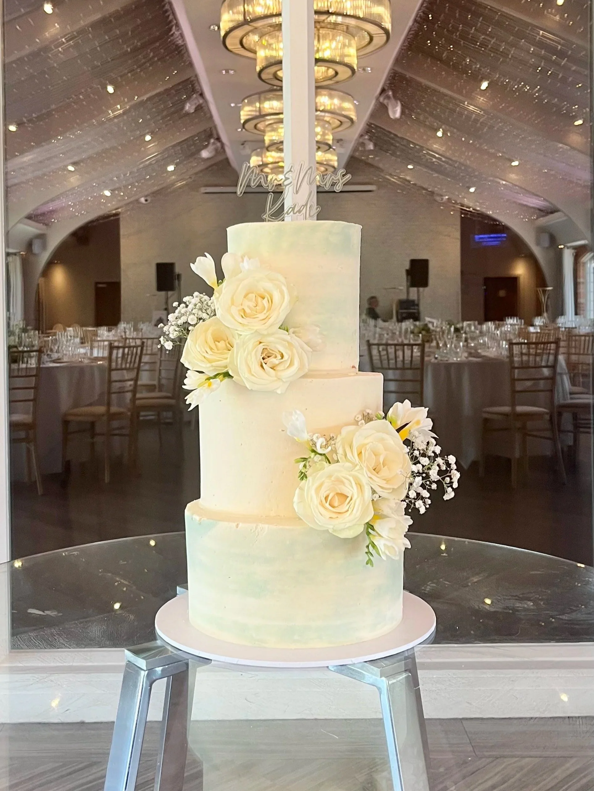 A three-tier rustic wedding cake