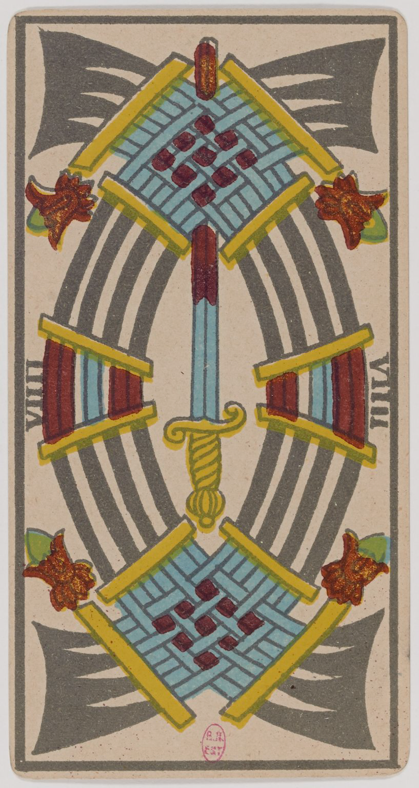 A symmetrical tarot card illustration featuring a sword, shields, and geometric patterns in red, blue, gray, yellow, and green. The design is decorative and stylized.