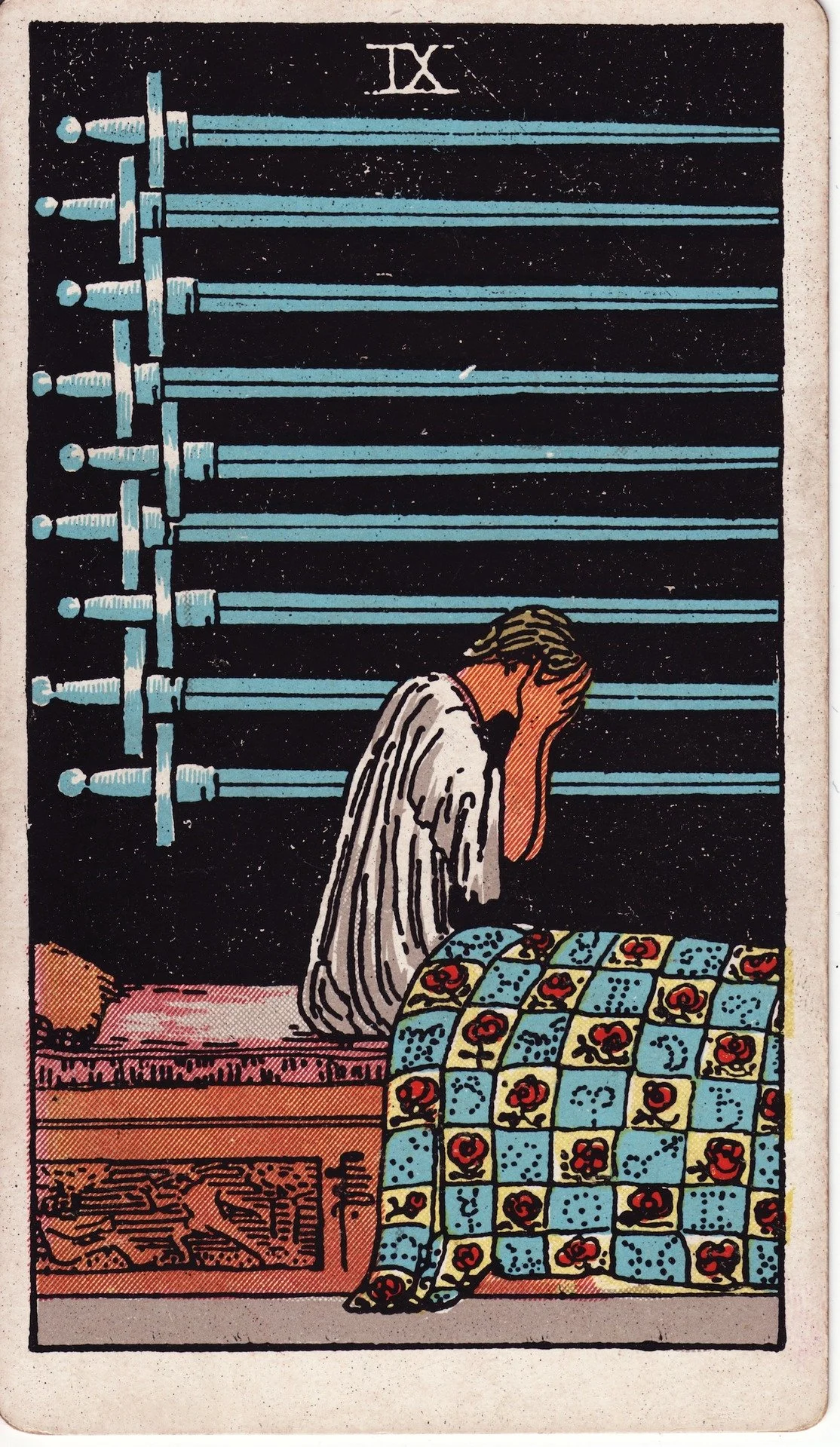 A man sitting on a bed, covering his face with his hands, with a pattern quilted blanket nearby. There are multiple swords hanging on the wall behind him, and the card is labeled 'IX' at the top.