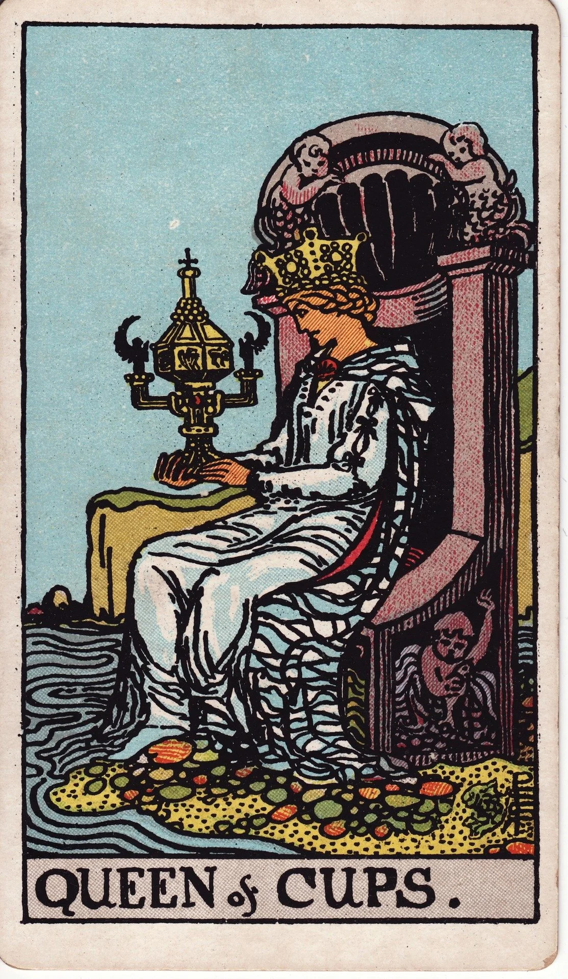 Tarot card titled 'Queen of Cups' depicting a woman seated on a throne holding a chalice, with water and coins at her feet.