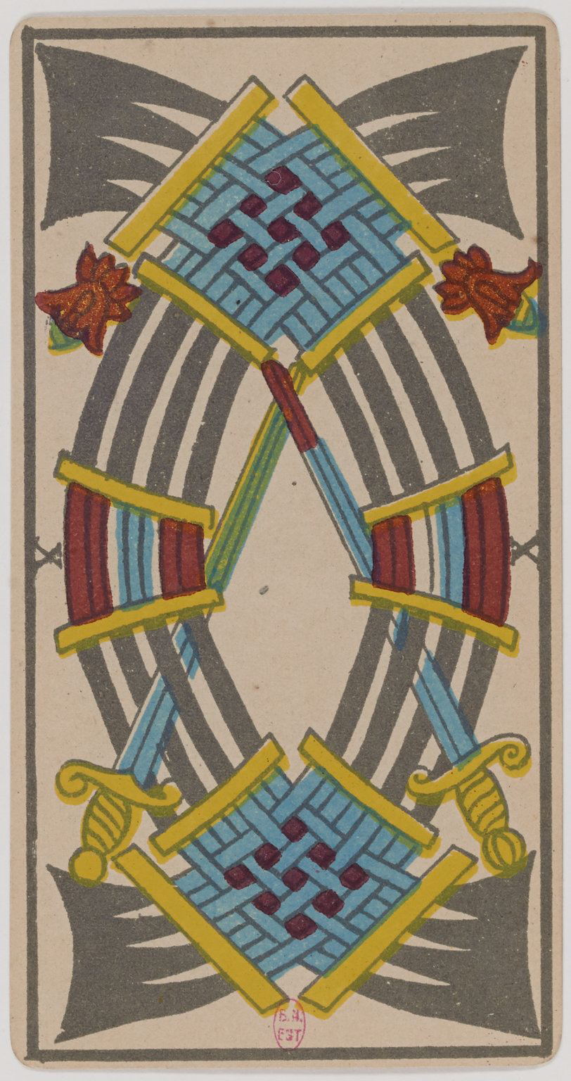 Back of a playing card with a symmetrical geometric design in blue, red, yellow, black, and green colors.