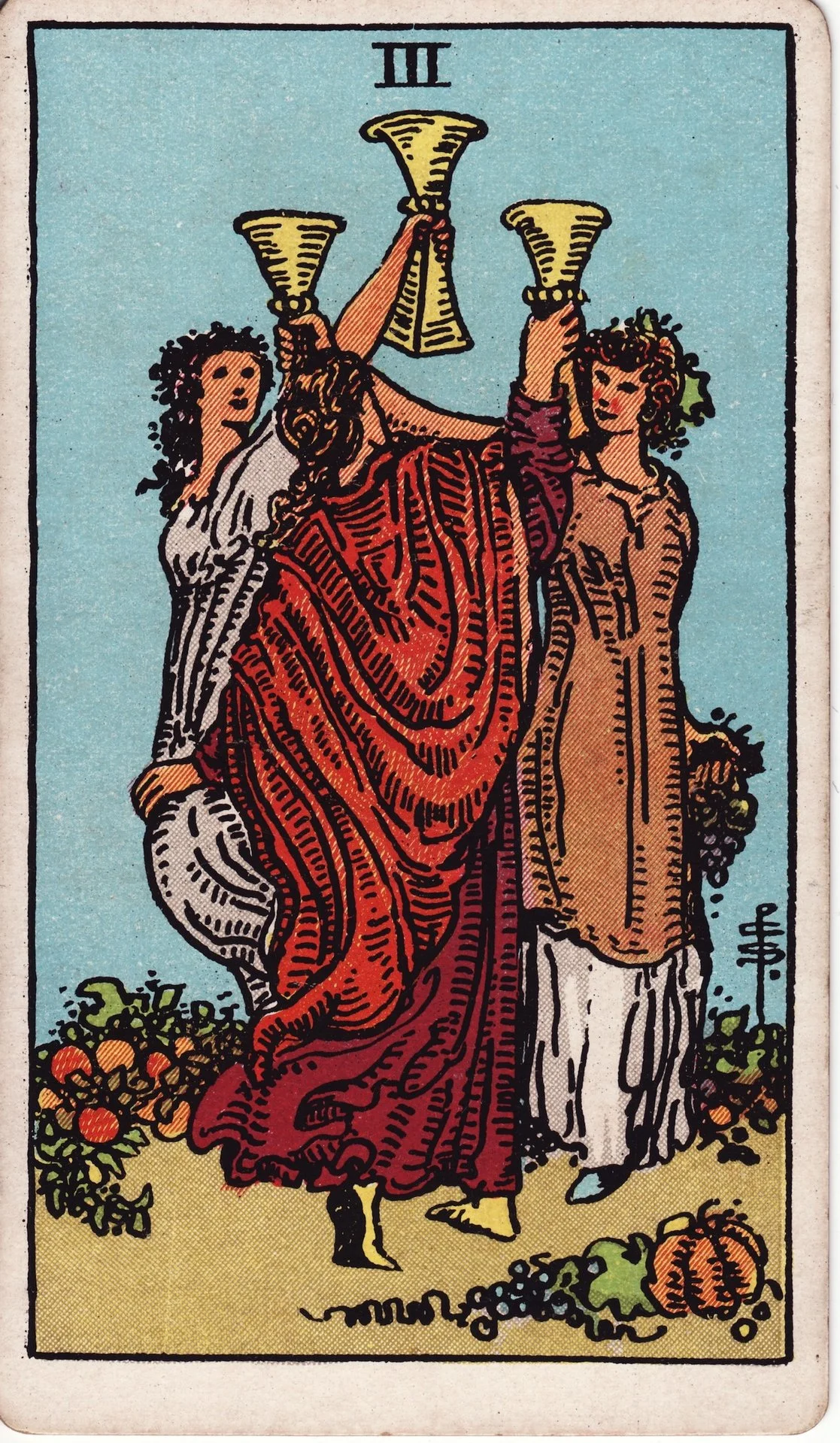 Three women holding large trumpets, one with a lion mask, standing on a ground with pumpkins and gourds, in a tarot card with the Roman numeral III at the top.