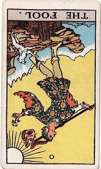 The Fool tarot card showing a person with a dog, a pack on their back, stepping off a cliff with a small bag, overlooking a sunrise or sunset.