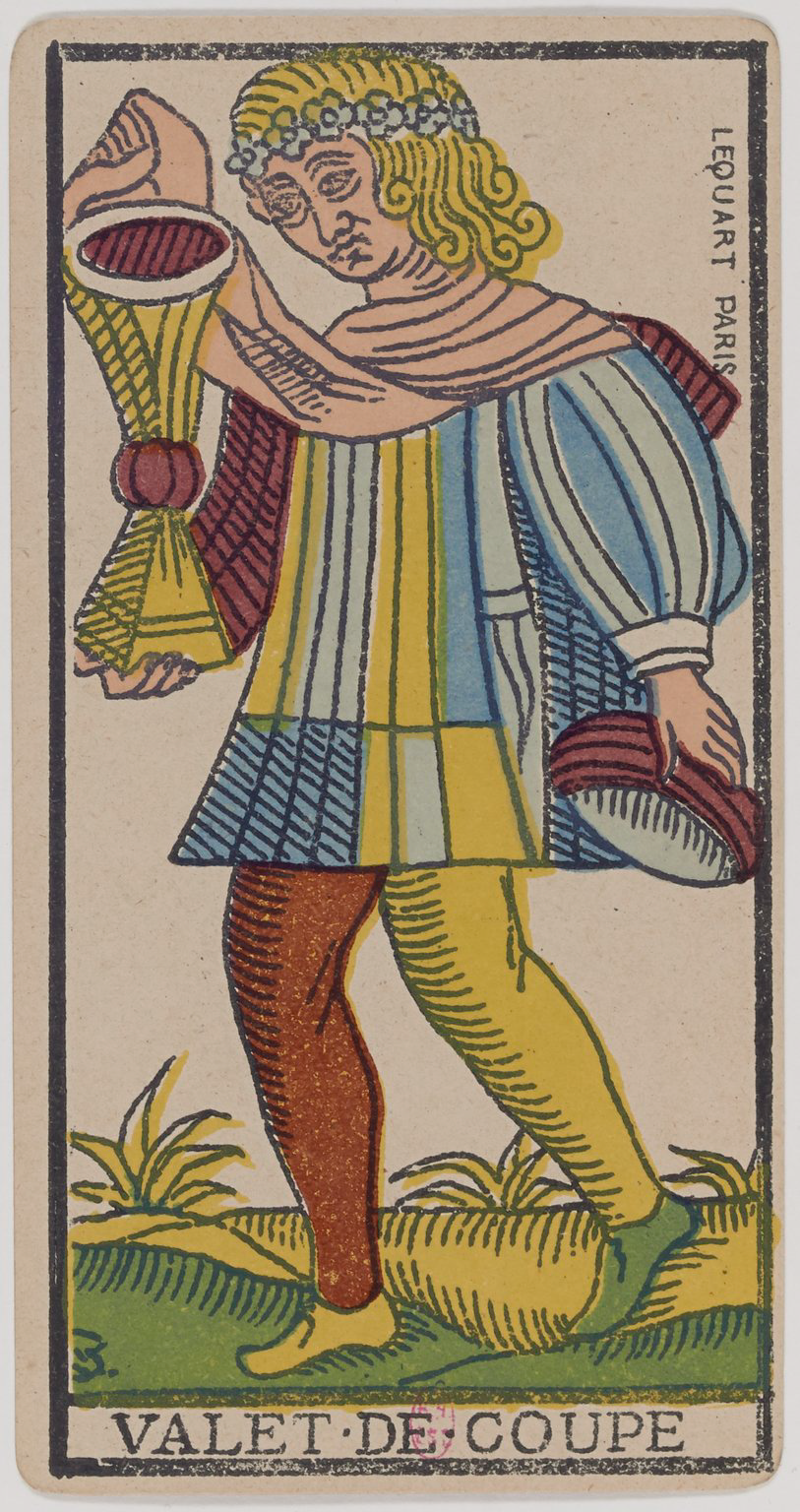 A vintage tarot card titled 'Valet-de-Coupe' depicting a young man with long, curly blonde hair wearing a colorful, striped outfit holding a closed cup in one hand and a taller, open cup in the other. The background shows grass and plants, and the card has a border with text on the right side indicating 'L'euvert Paris.'