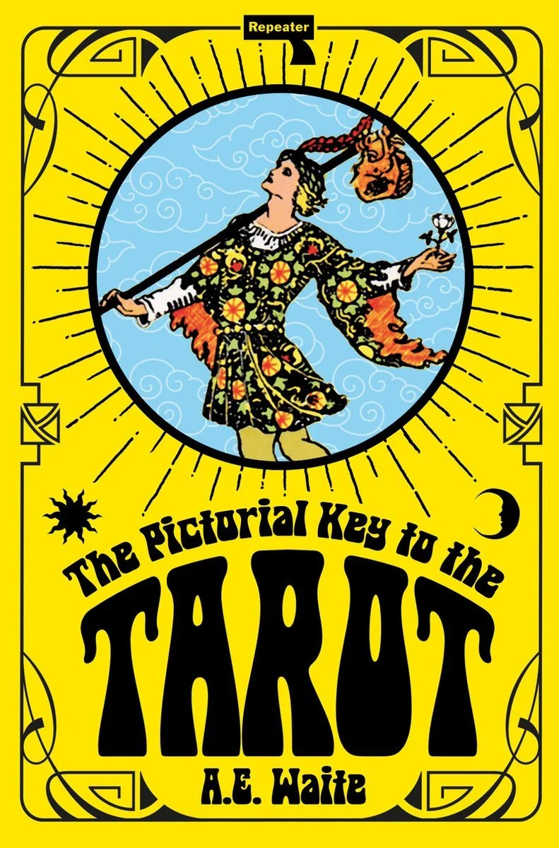 Book cover with a yellow background featuring a central illustration of a woman with flowing hair holding a broomstick with a witch's head hanging from it, surrounded by stylized clouds. The title reads "The Pictorial Key to the Tarot" by A.E. Waite, with decorative borders and symbols including a sun, moon, and stars.