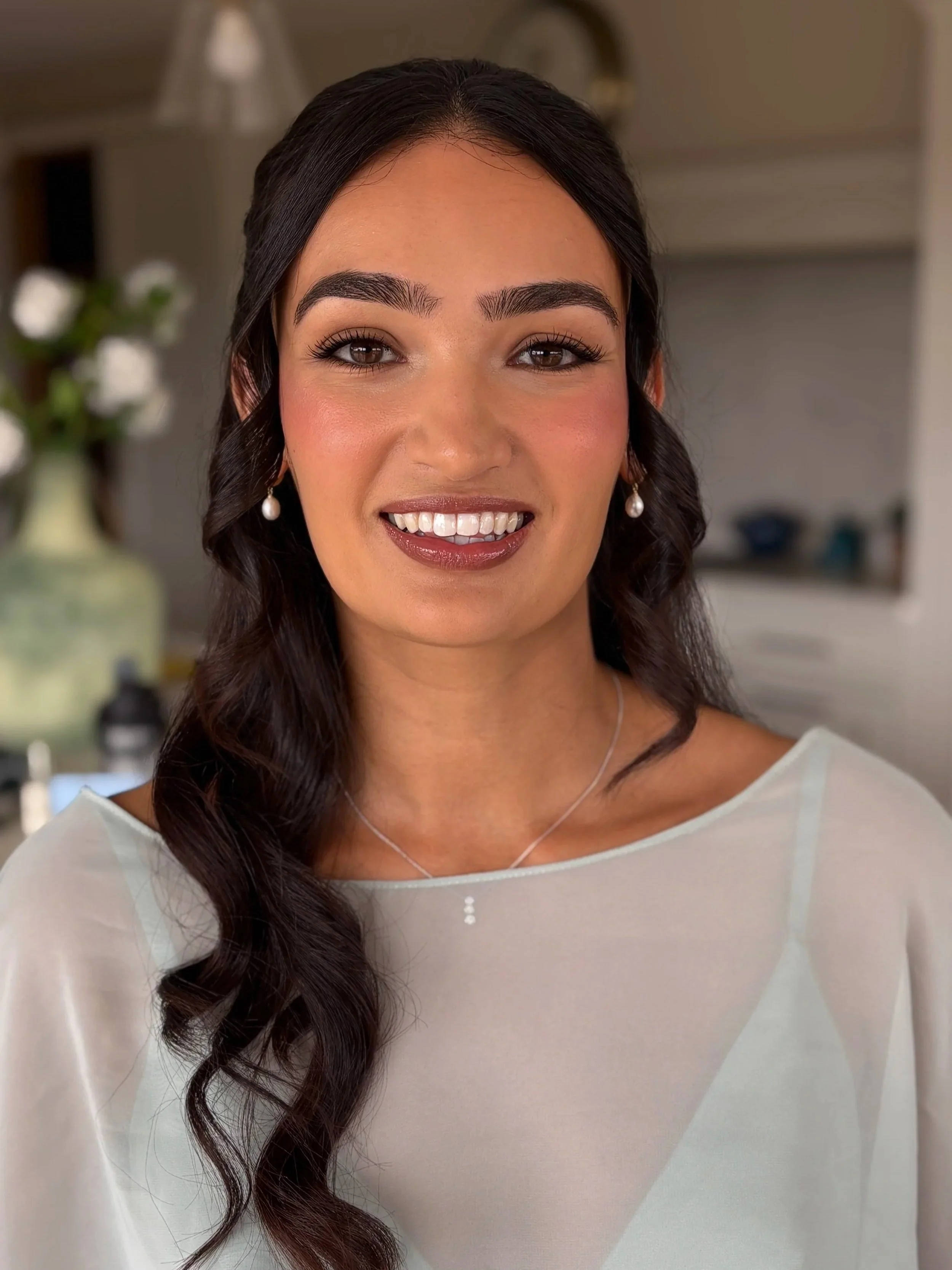 Beautiful brunette bridesmaid with brown eyes and natural makeup 