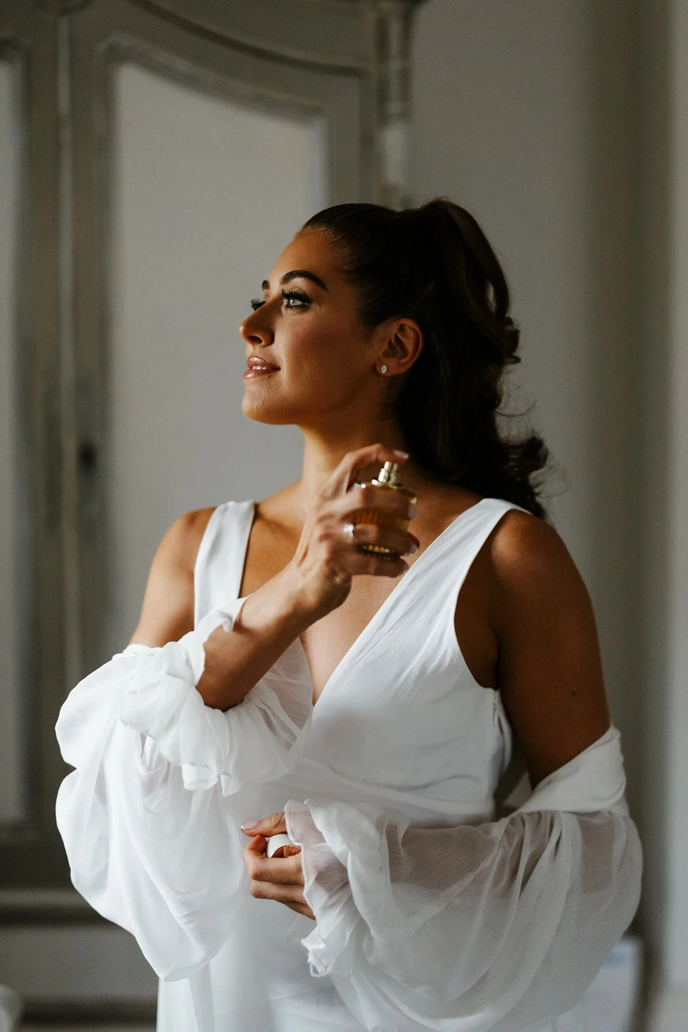 beautiful brunette bride with glowing makeup in manor by the lake wedding venue in cheltenham