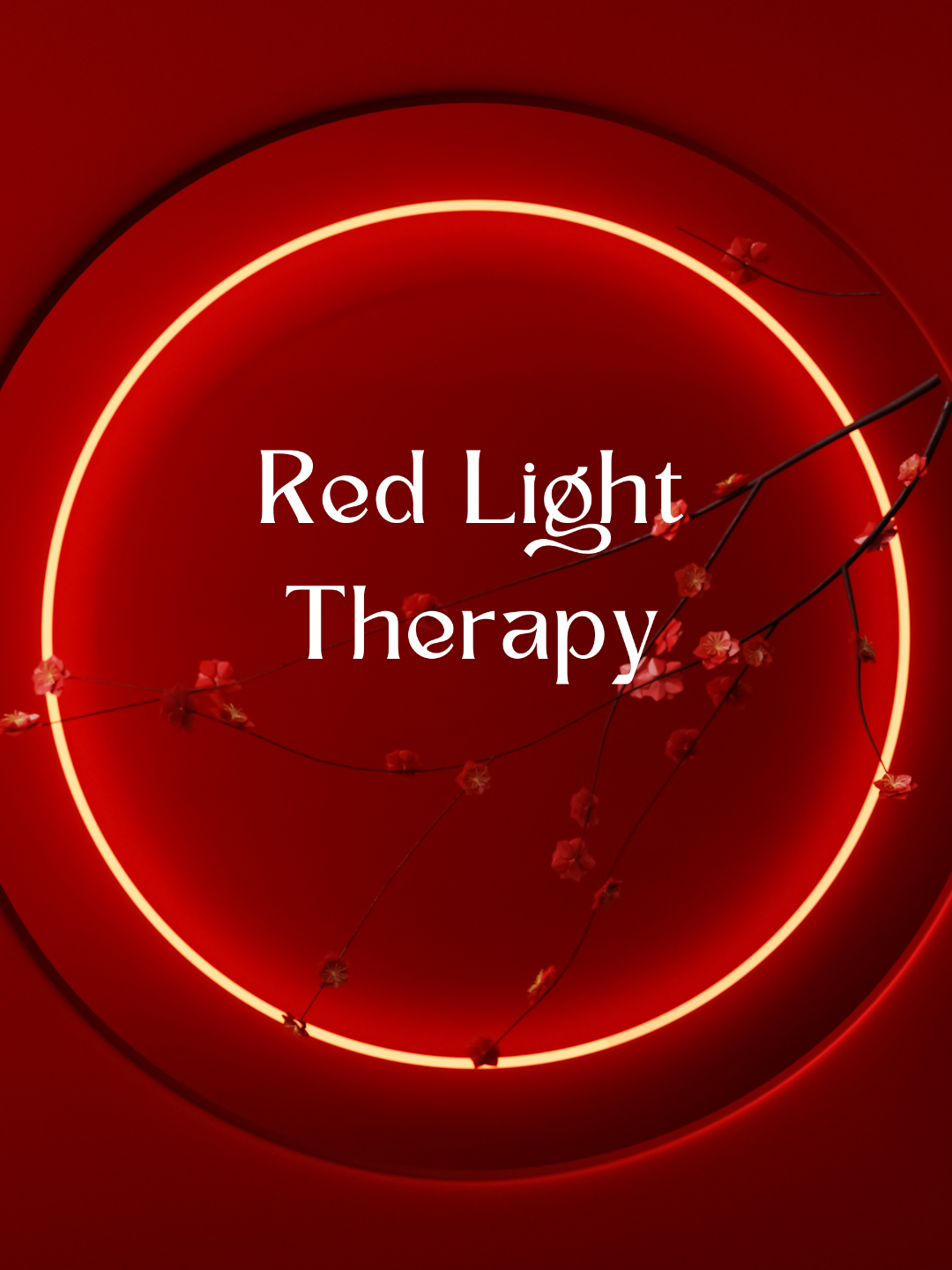 Red circular neon light with small pink flowers on thin branches and white text that reads 'Red Light Therapy' in the center.