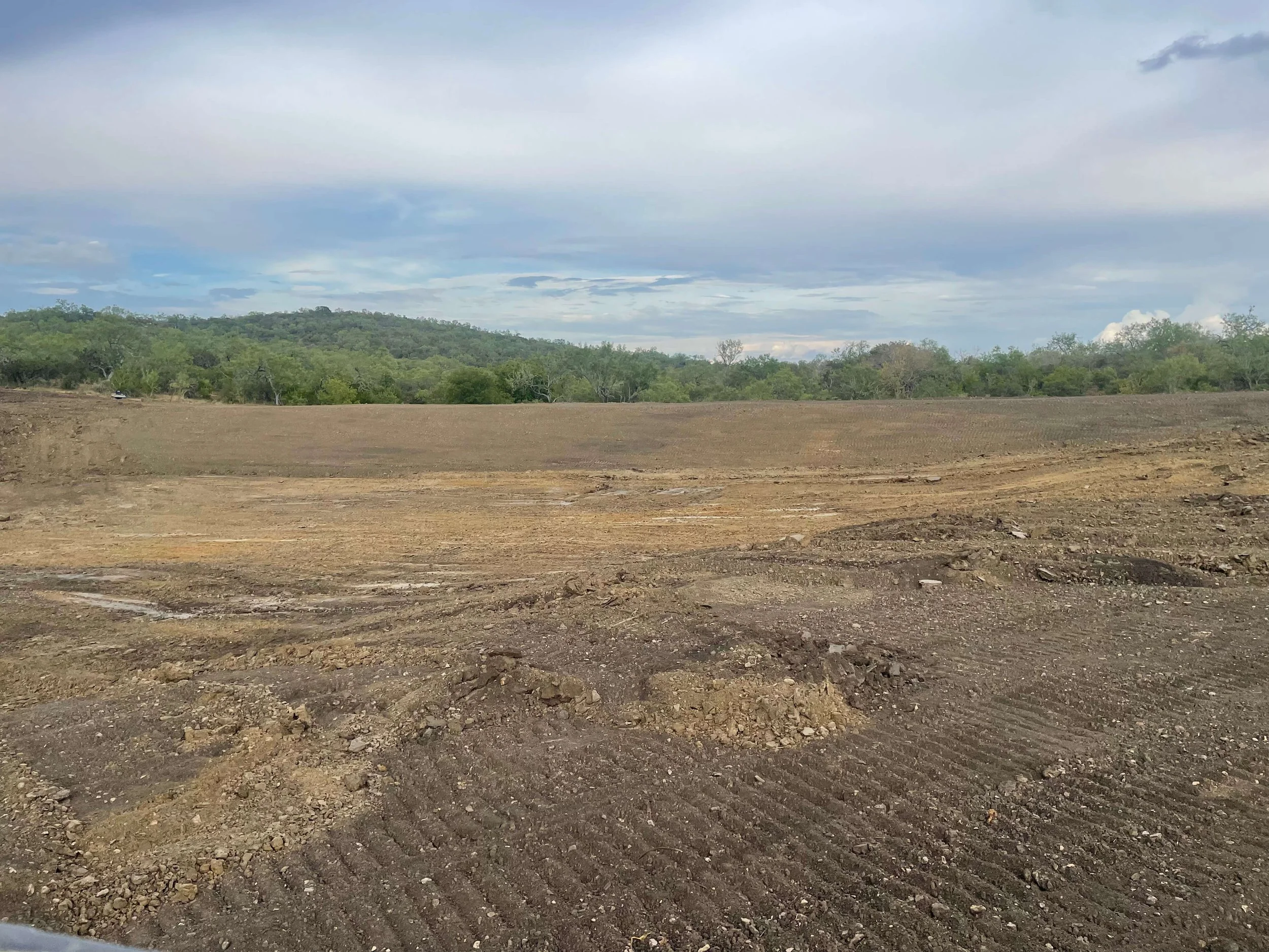 FINAL GRADE ON POND DAM