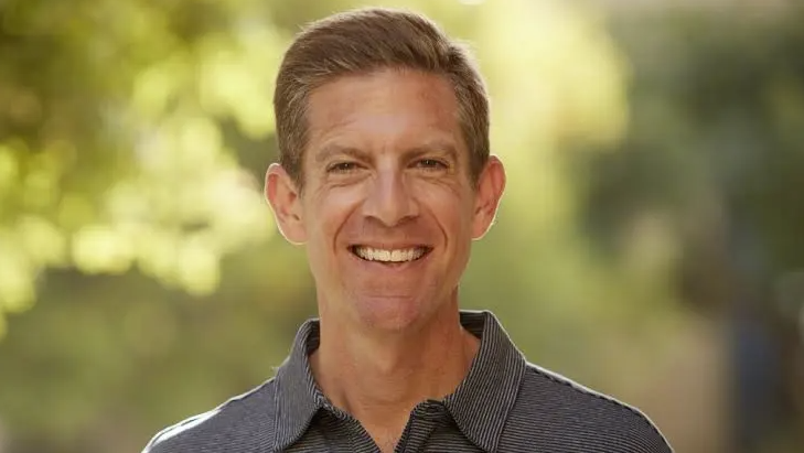 A photo of Mike Levin wearing a striped polo shirt