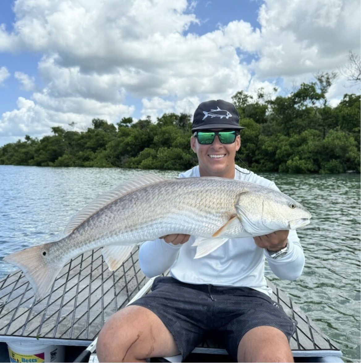 Chris holding up a 27" redfish