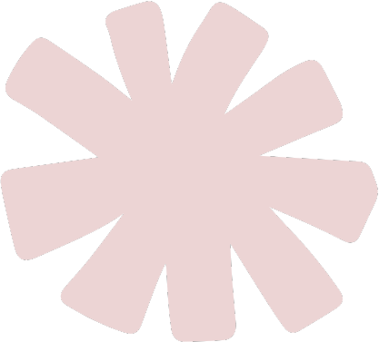 Pink flower-shaped graphic with rounded petals on a black background.