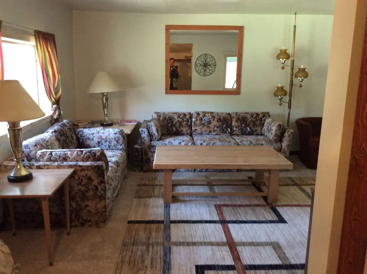 A cozy and rustic living room in a rental Blue Cabin in Elk City, Idaho
