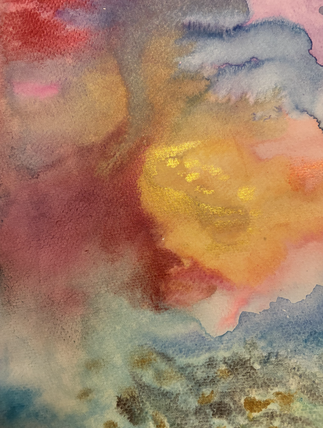 Abstract watercolor painting with warm colors including red, orange, yellow, and hints of blue and purple, featuring a blend of soft and textured brushstrokes.