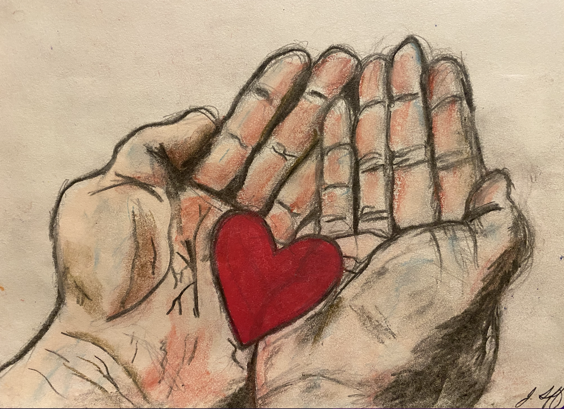 two hands holding a heart