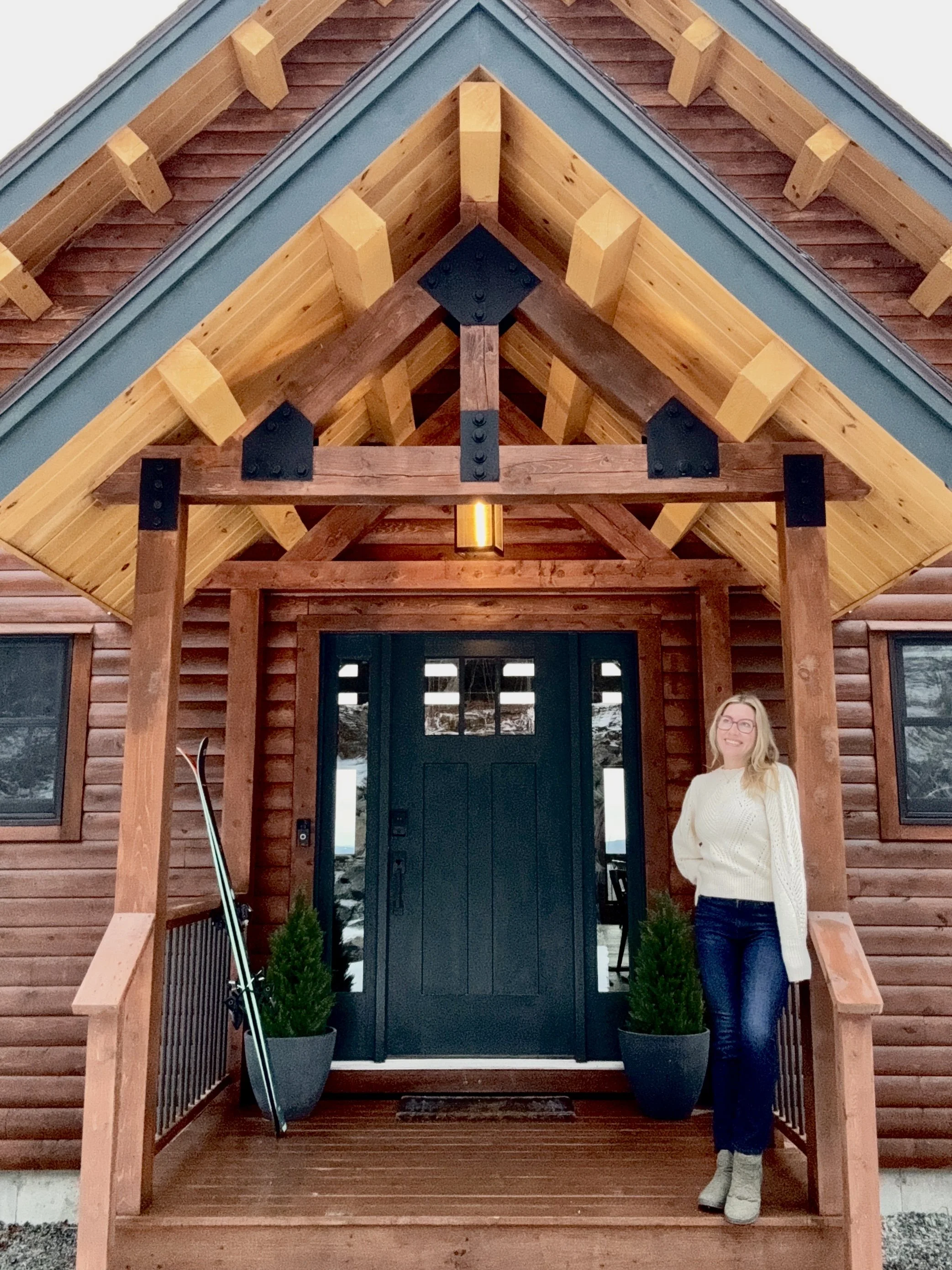 Danielle Iannotti at Sugar Moon Cabin, her vacation rental in New Hampshire’s White Mountains that helped inspire Vacation Homes for Good™