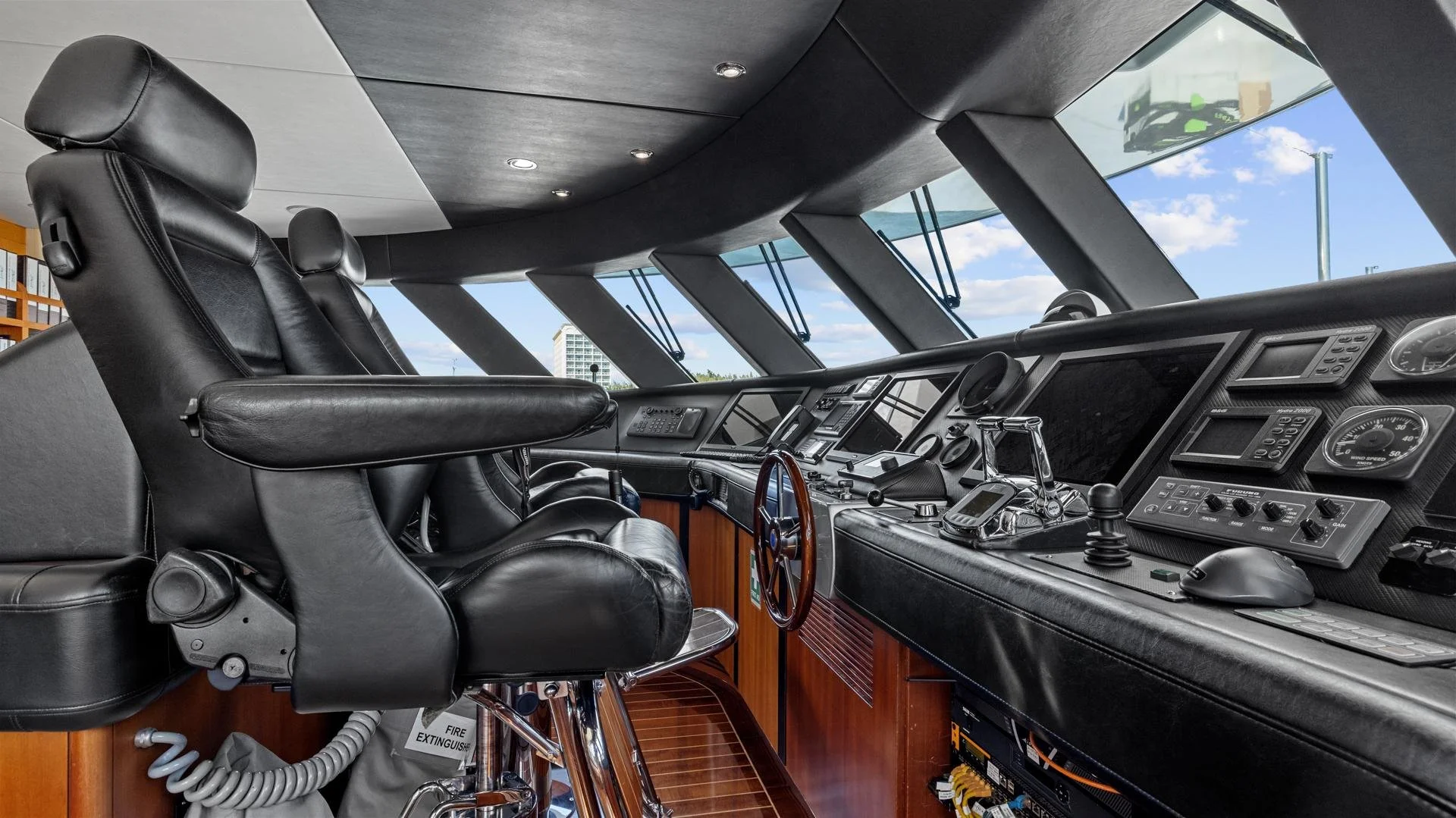 Bridge control center on the superyacht spirit 35m, black leather seat and computers
