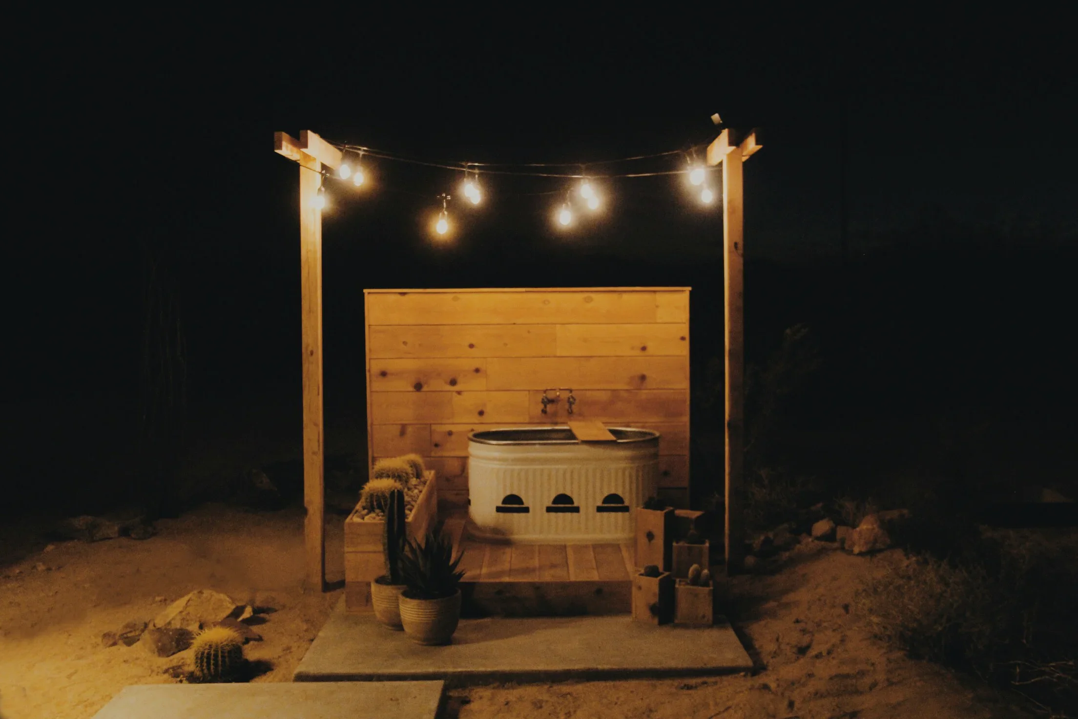 The+Shack+Attack+-+Outdoor+Tub+at+Night+-+www.weareinourelement.com.jpg.webp