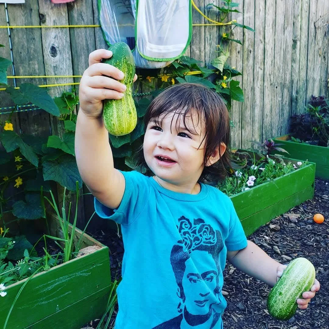 kid with squash.jpeg