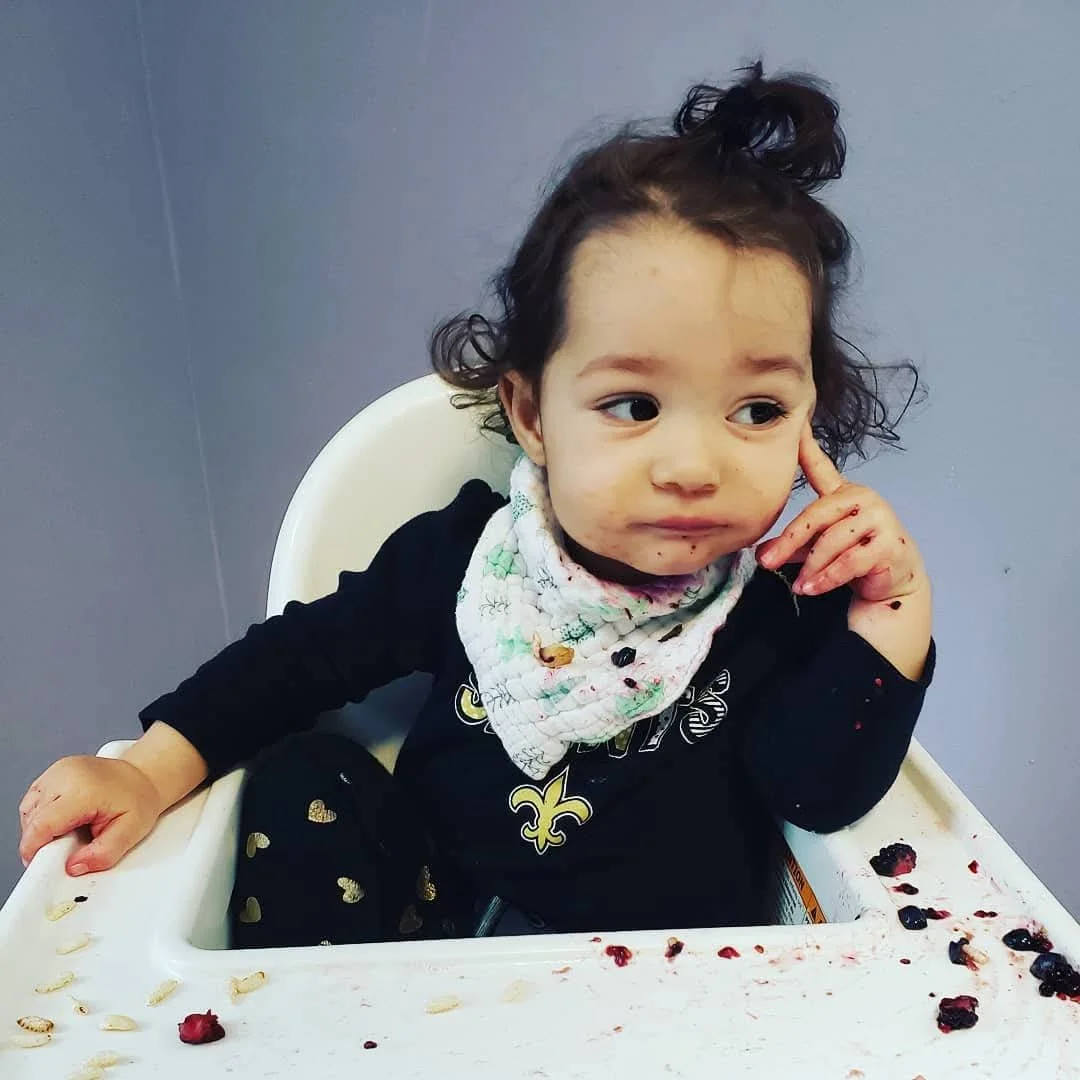 kid in high chair.jpeg