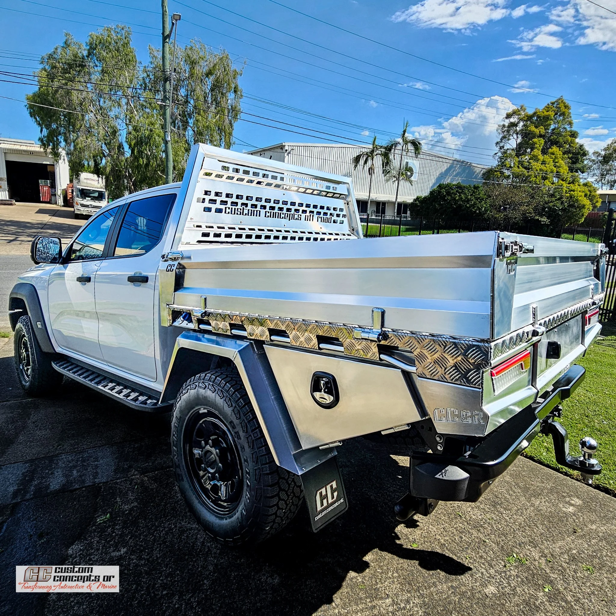 Toyota Hilux dual cab fitted with a custom CCOR aluminium Tradie Tray, under-tray toolboxes, rear drawer and water storage.