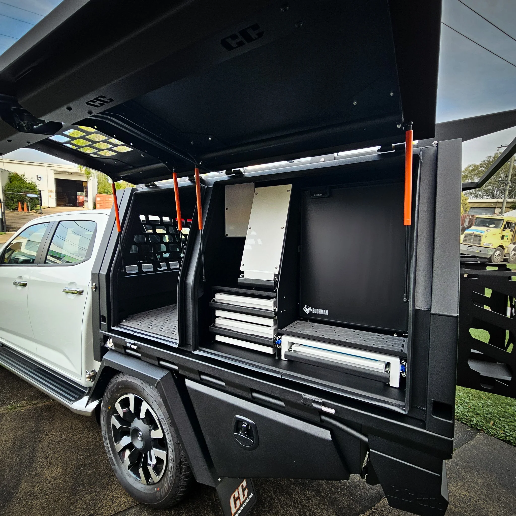 Custom canopy fitout with integrated Bushman fridge, storage drawers and slide-out compartments for touring and trade applications.