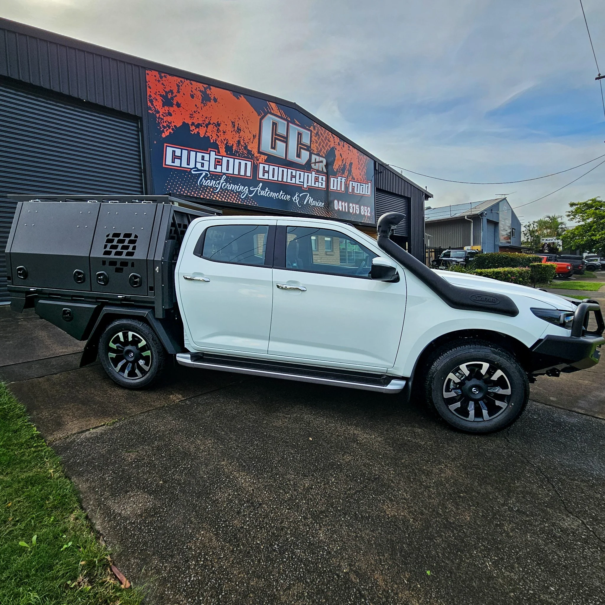 Side profile of custom Mazda BT-50 canopy build showcasing aluminium construction, side storage access and premium powder coated finish.