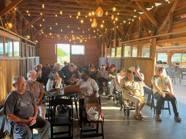 Audience listenting at Winter in America (Again reading at Finnriver Farm & Cidery