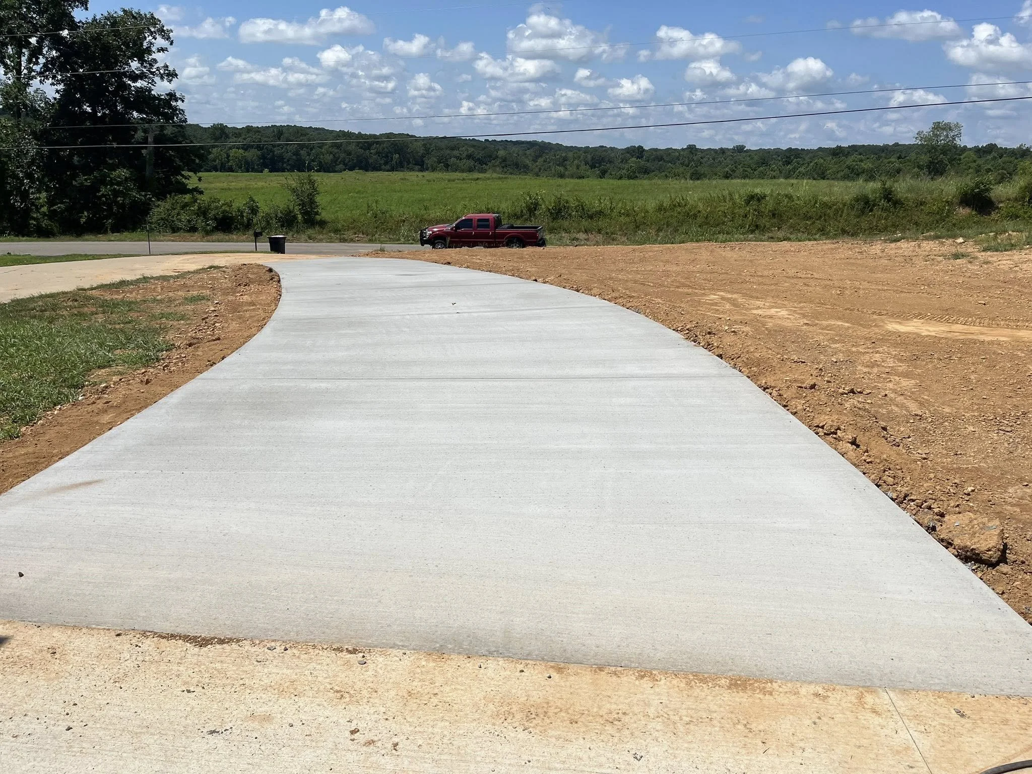 Installation of an additional concrete driveway, back view.