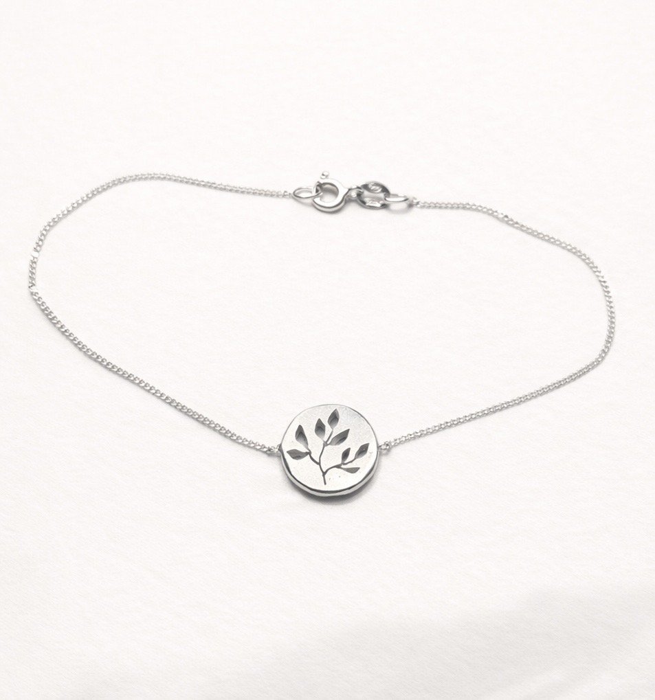 silver-flora-disc-bracelet.jpg