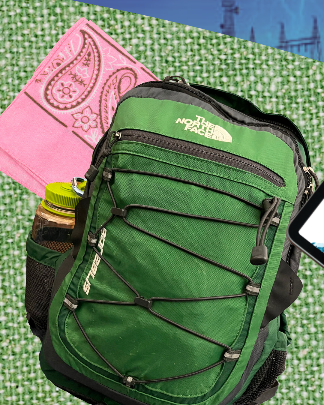 green backpack with water bottle and pink bandana