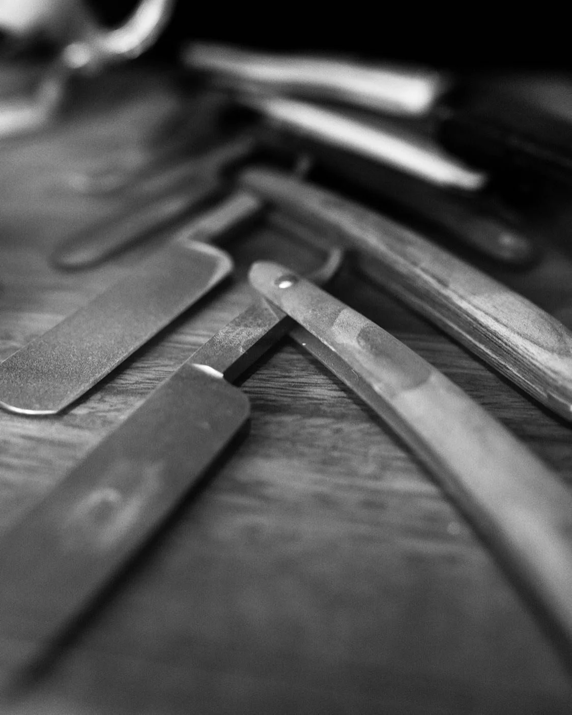 Horse and Lion Barber Co. Shaving Tools Zoomed in on a woodern surface
