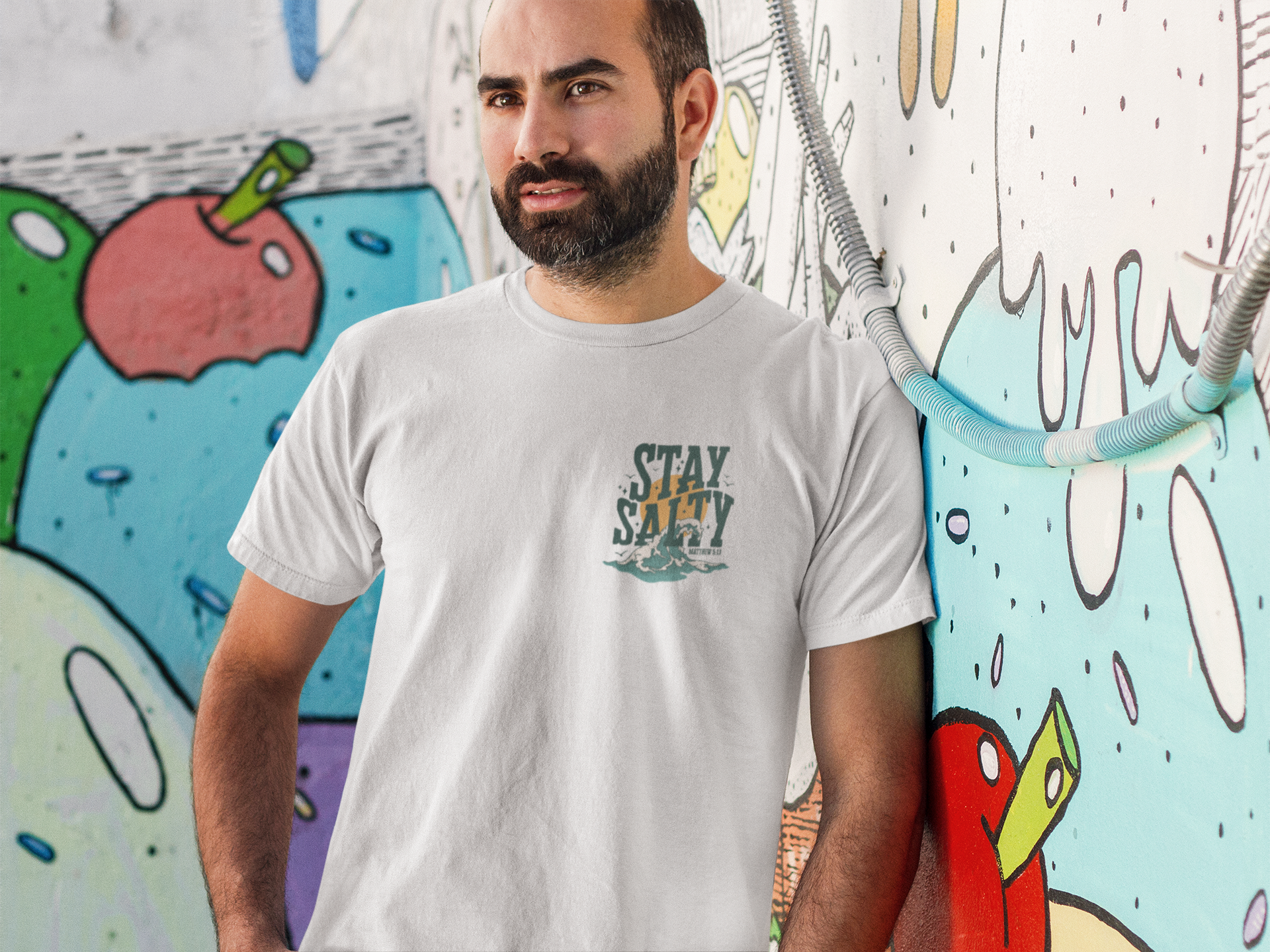 man-standing-in-front-of-a-graffiti-wall-t-shirt-mockup-a8221.png