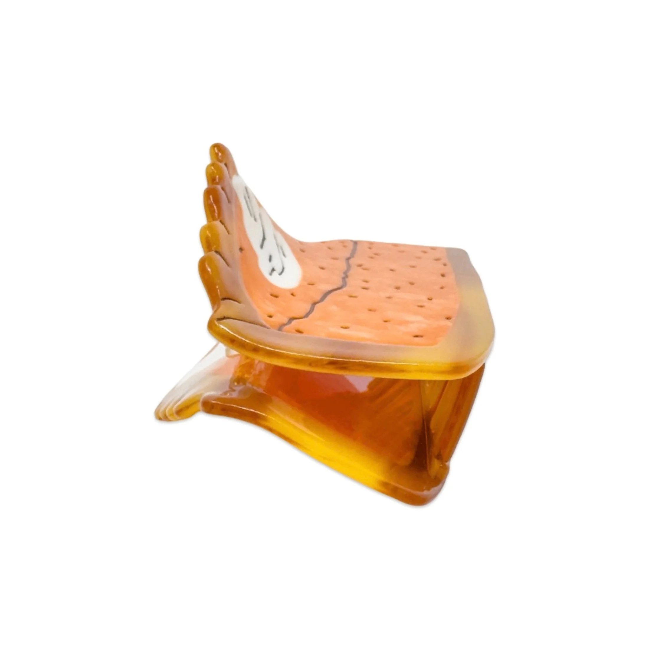 Side view of pumpkin pie slice hair claw by Jenny Lemons