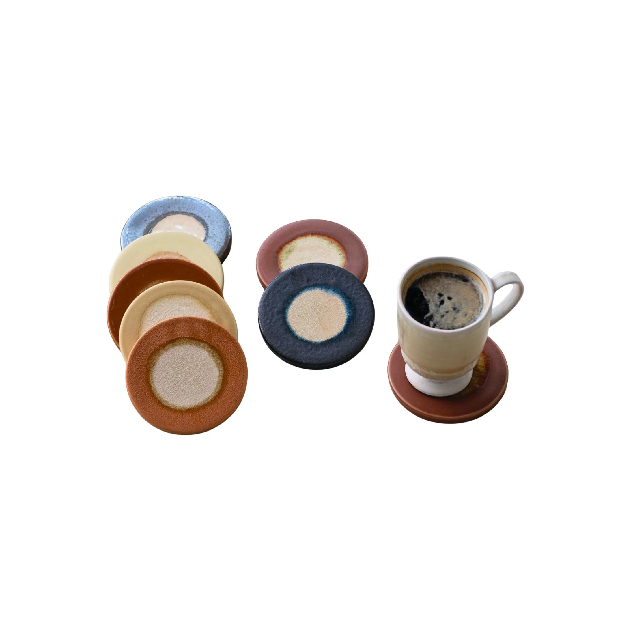 Eight round stoneware coasters in assorted reactive glaze colors