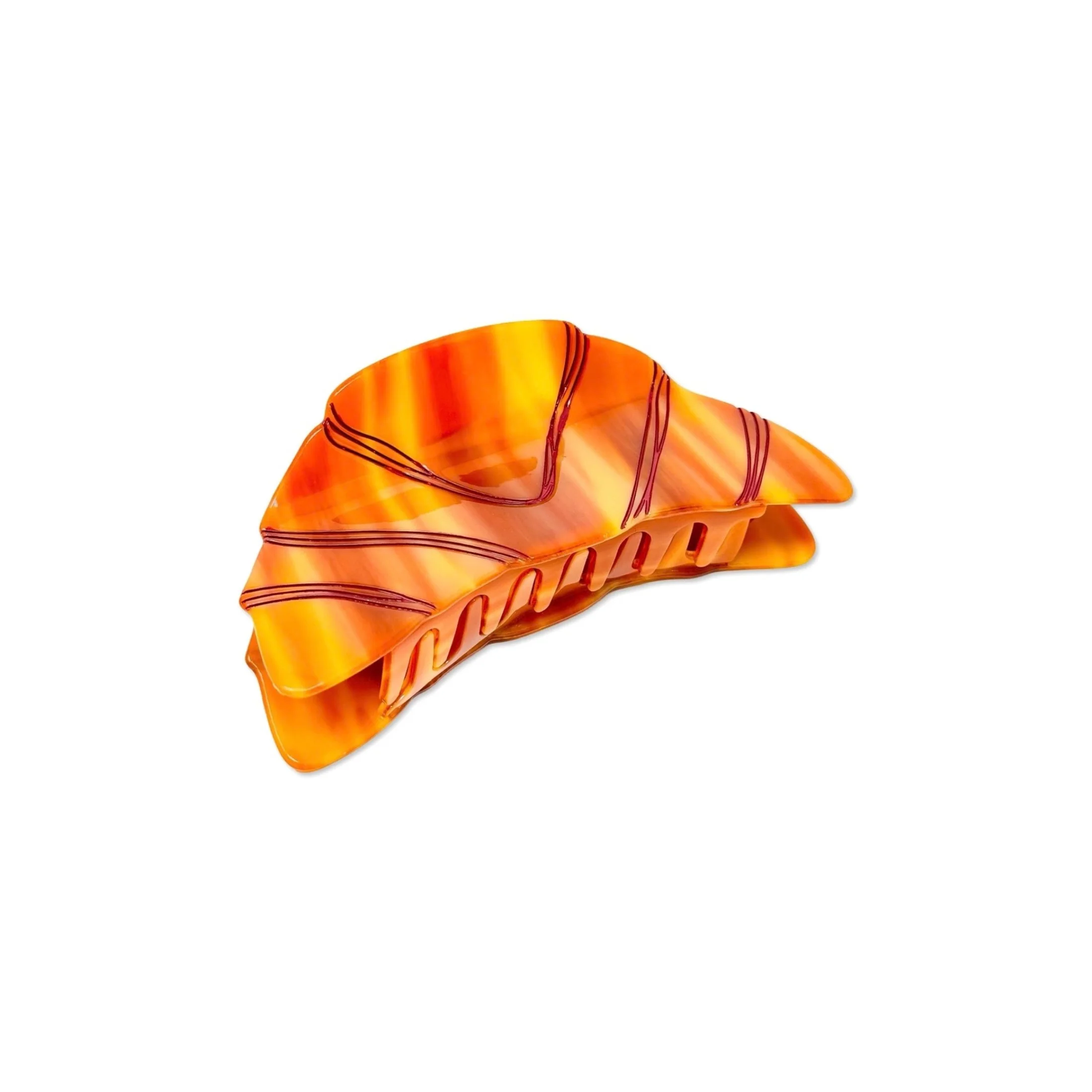 Angled view of oversized croissant hair claw by Jenny Lemons