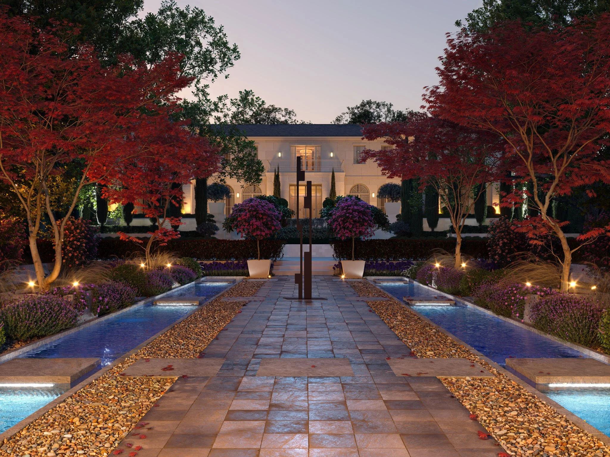 A well-lit landscaped garden with a central walkway, small water features on each side, colorful flowers, and trees with red and green foliage, leading to a large elegant house in the background.