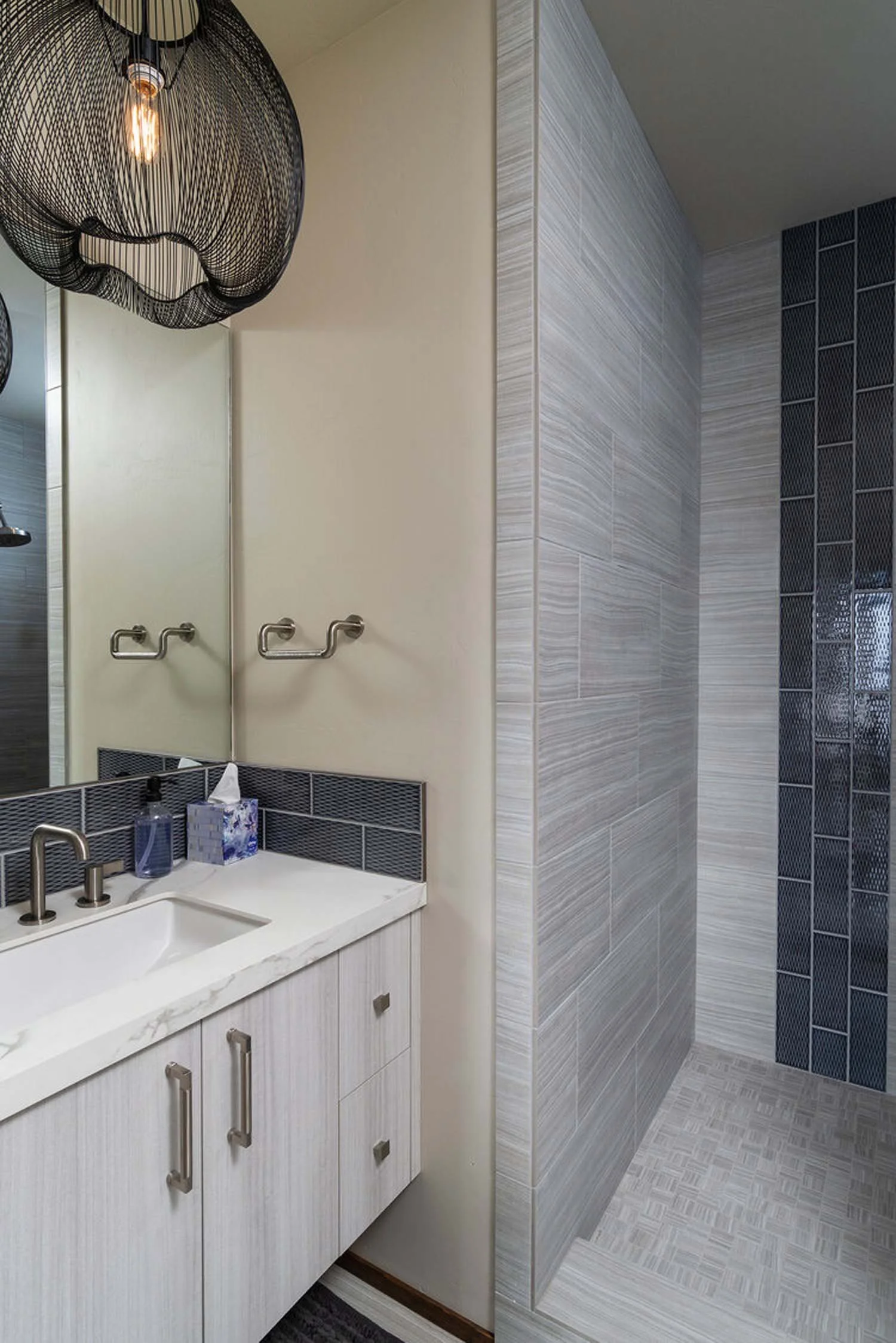 This sleek, modern bathroom, a perfect blend of style and function, is a showcase of a Pacwest Builders' high-end residential project. As a top home builder and contractor in Central Oregon and Bend, Oregon, our design/build process ensures every det