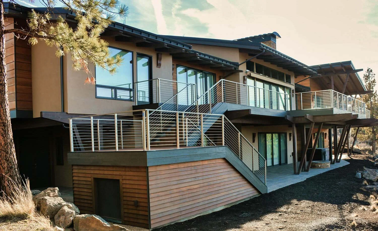 As experienced builders of luxury custom homes in Central Oregon, Pacwest Builders masterfully designed this multi-level residence at North Rim - Wild Rye. This image highlights the home’s striking architecture, including its beautiful wooden exterio