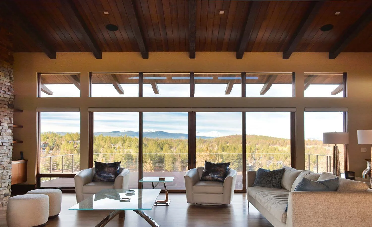 As experienced builders of luxury custom homes in Central Oregon, Pacwest Builders crafted this beautiful living room at North Rim - Wild Rye. The space, with interiors by Kristy Yozamp, is designed to take full advantage of the wide scenic views of
