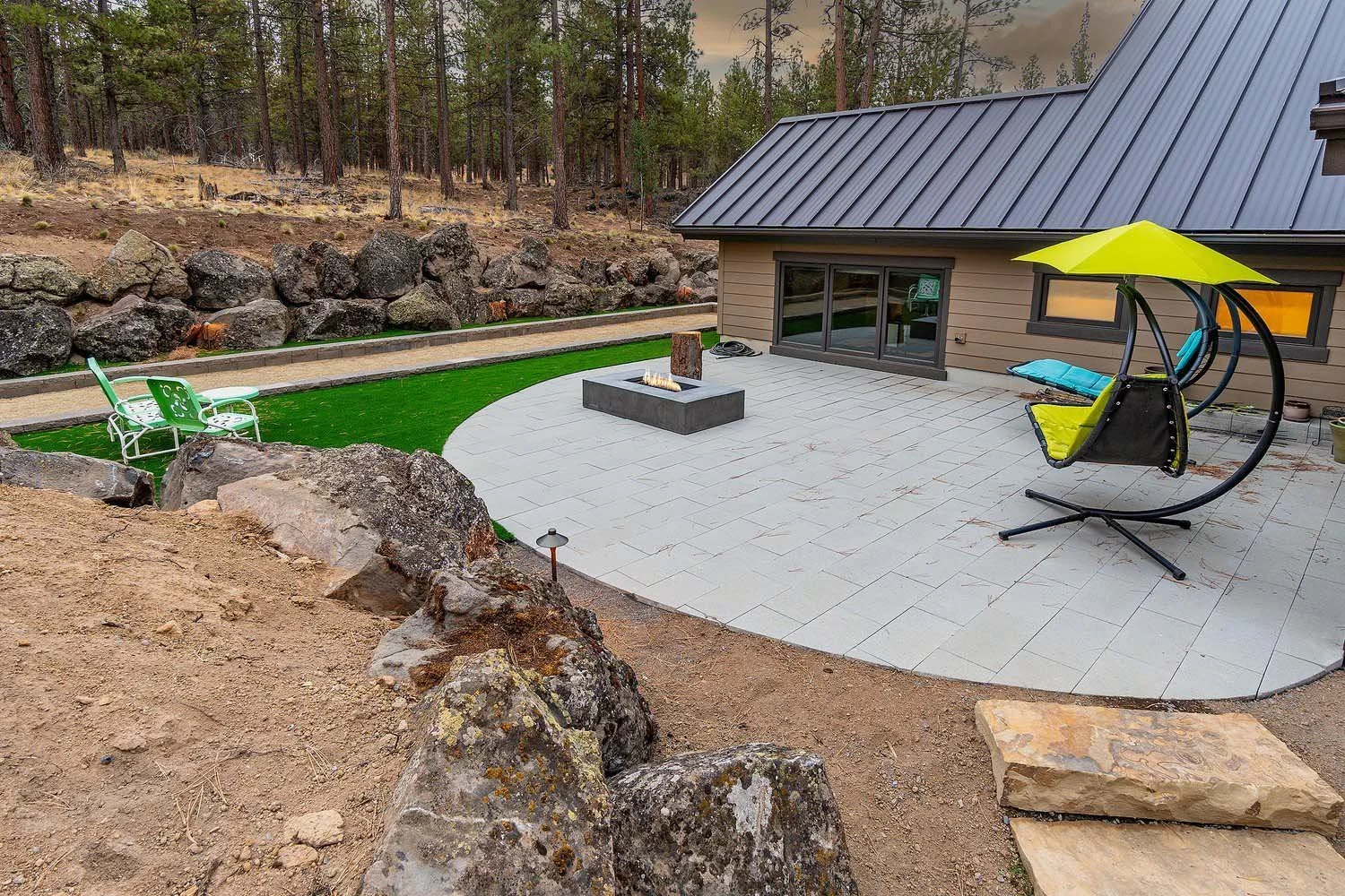 As experienced builders of luxury custom homes in Central Oregon, Pacwest Builders masterfully designed this unique outdoor living space at Skyline Ranch - Imbler. The custom landscaping by Earth Designs Landscaping highlights the home's dedication t