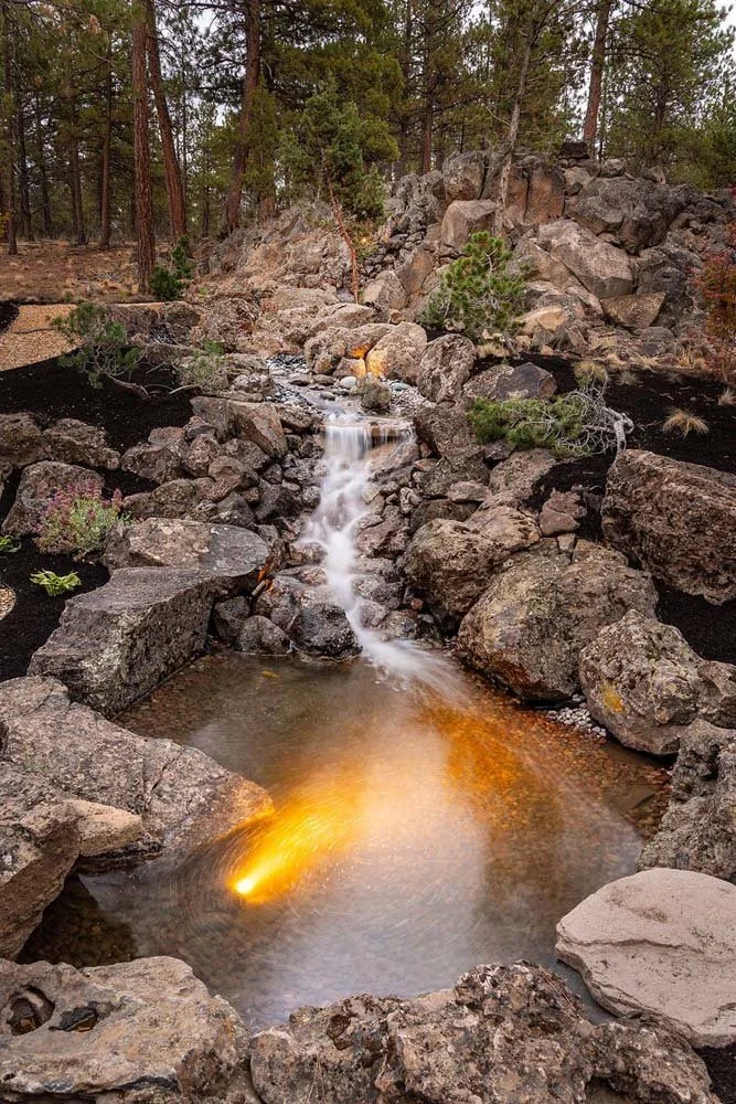 As experienced builders of luxury custom homes in Central Oregon, Pacwest Builders masterfully designed this unique residence at Skyline Ranch - Imbler for a couple who love to entertain. The custom water feature by Earth Designs Landscaping highligh