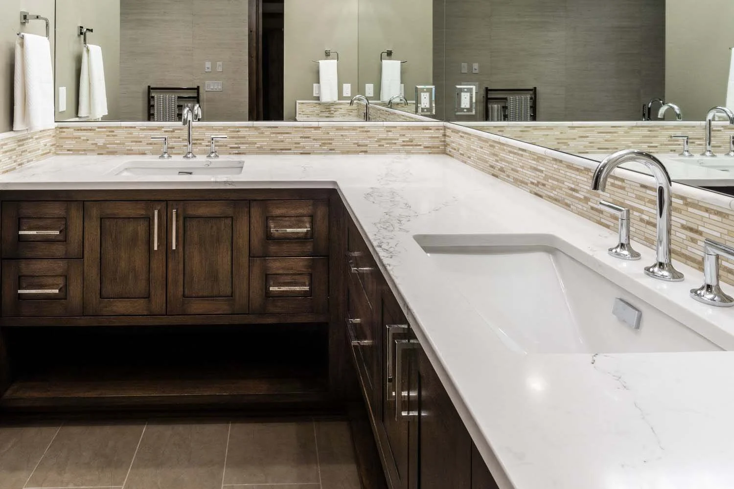 As experienced builders of luxury custom homes in Central Oregon, Pacwest Builders crafted this award-winning bathroom at North Rim - Wild Rye. This image, with interiors by Kristy Yozamp, highlights a stunning modern bathroom vanity with a white mar