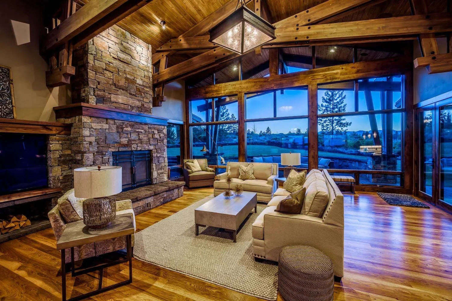 Spencer Williams with Pacwest Builders masterfully designed this stunning mountain modern luxury custom home in Central Oregon, at Tetherow - Hawk Court. The home highlights a striking architecture, including a beautiful stone fireplace, a stunning w