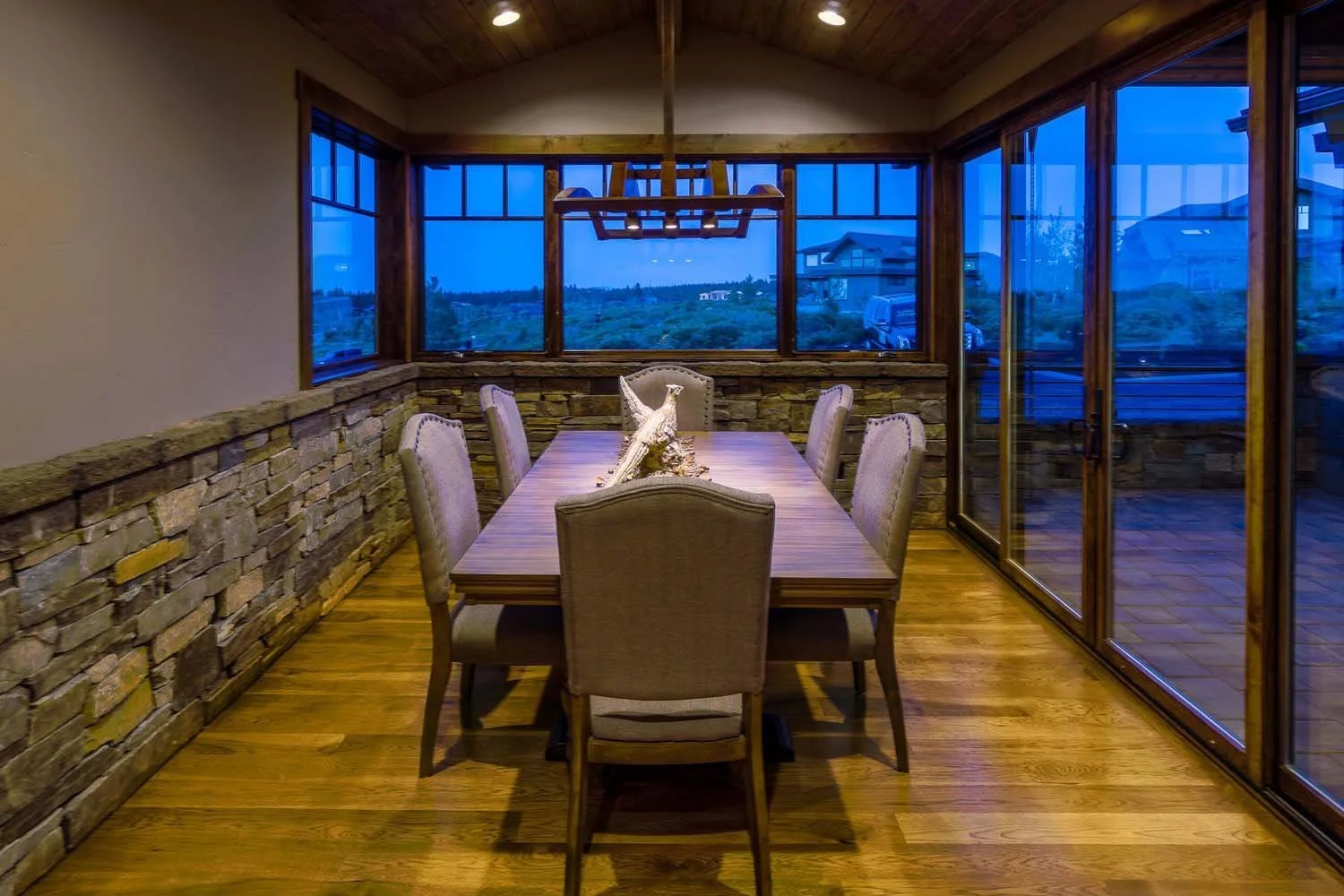 Pacwest Builders designed this stunning mountain modern luxury custom home in Central Oregon, at Tetherow - Hawk Court. The home, designed by Spencer Williams, highlights a striking architecture, including beautiful stone accent walls and expansive l