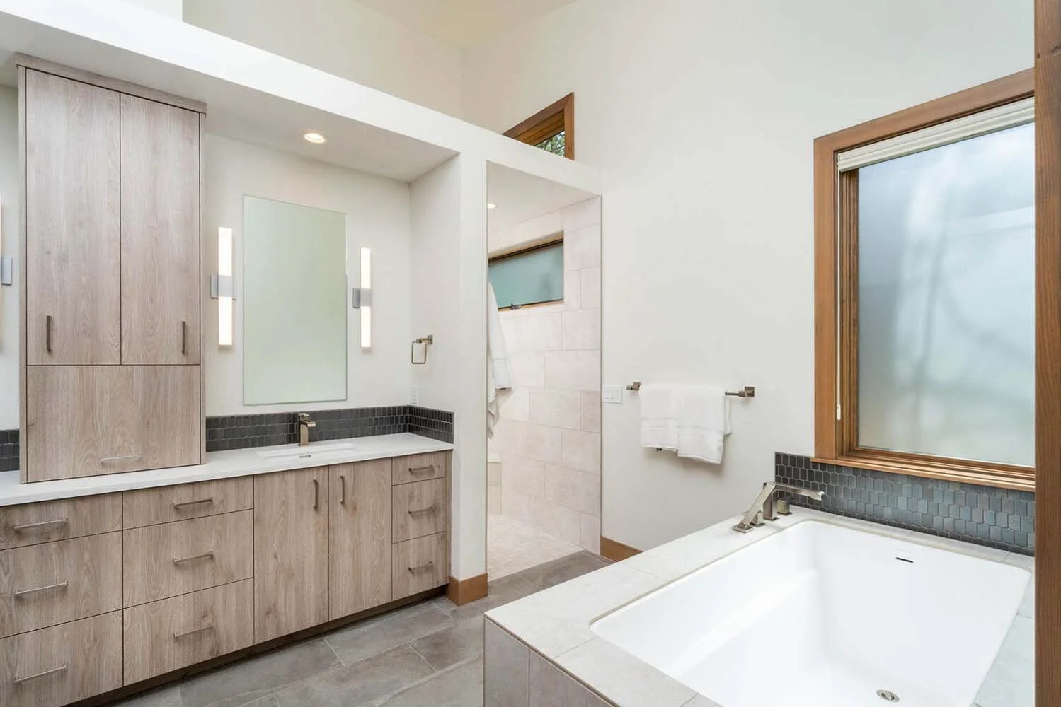 Pacwest Builders designed this award winning modern luxury custom home in Central Oregon, at Tetherow - Meeks Trail. This home, a "Best of Show" winner in the 2017 COBA Tour of Homes, designed by Spencer Williams, highlights a striking architecture,