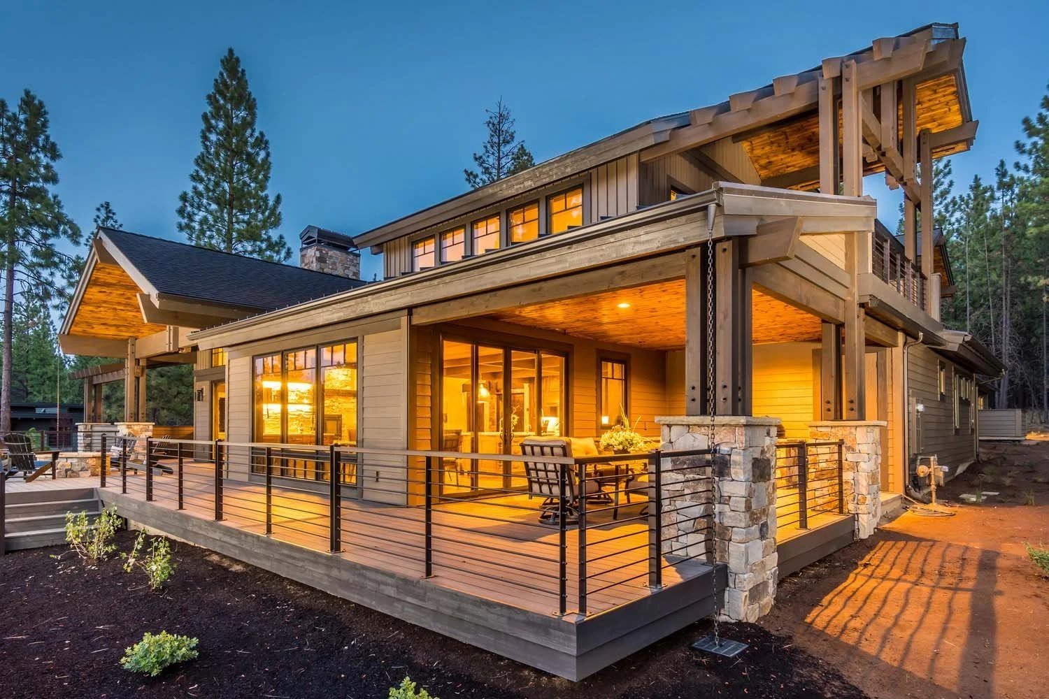 This stunning residence in Tetherow - Bainbridge Court, a 2017 COBA Tour winner for "Best Architectural Design" and "Best of Show," is a masterpiece of architecture. The mountain modern home, designed by Spencer Williams, features large, illuminated
