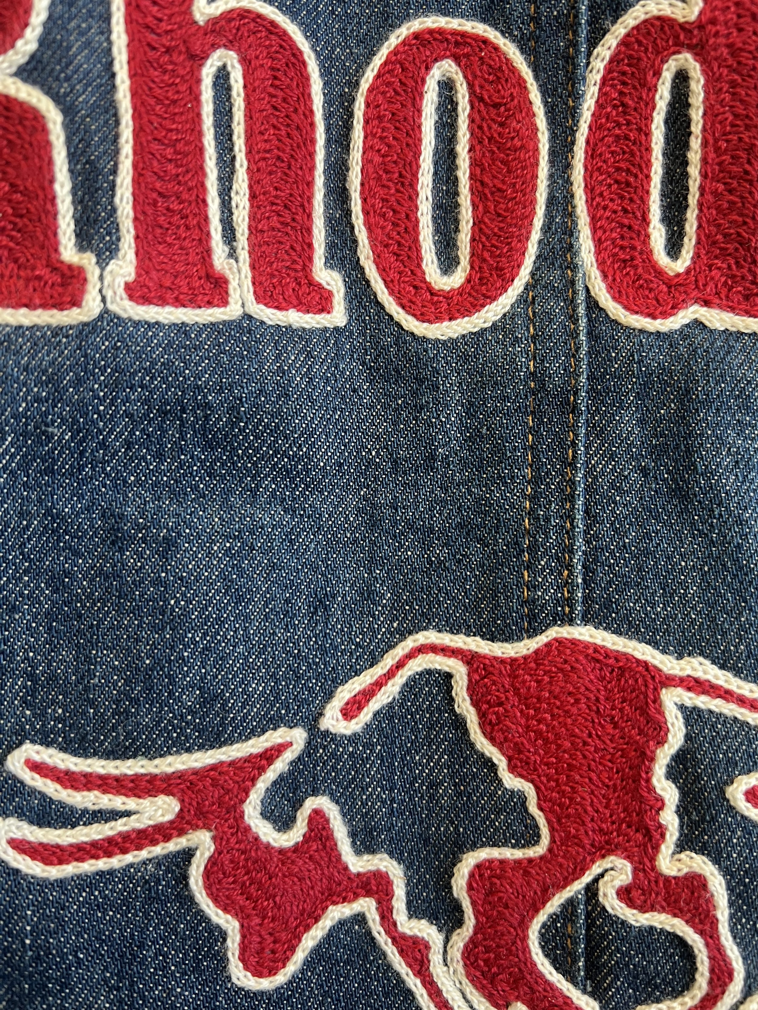Closeup of chainstitch embroidery on a vintage Levis jacket for Lauren Owen of Texas stitched and designed by Rhode and Sons using a vintage Cornely chainstitch machine from the 1950s.
