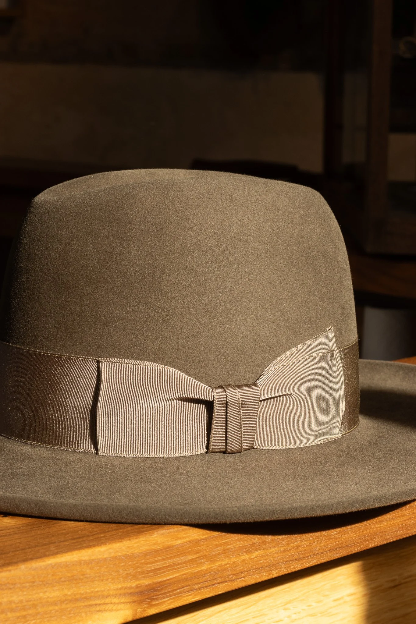 A gray fedora hat, handcrafted in Dallas, Texas. A custom order finished with a vintage gros grain ribbon. Pure beaver felt hats.