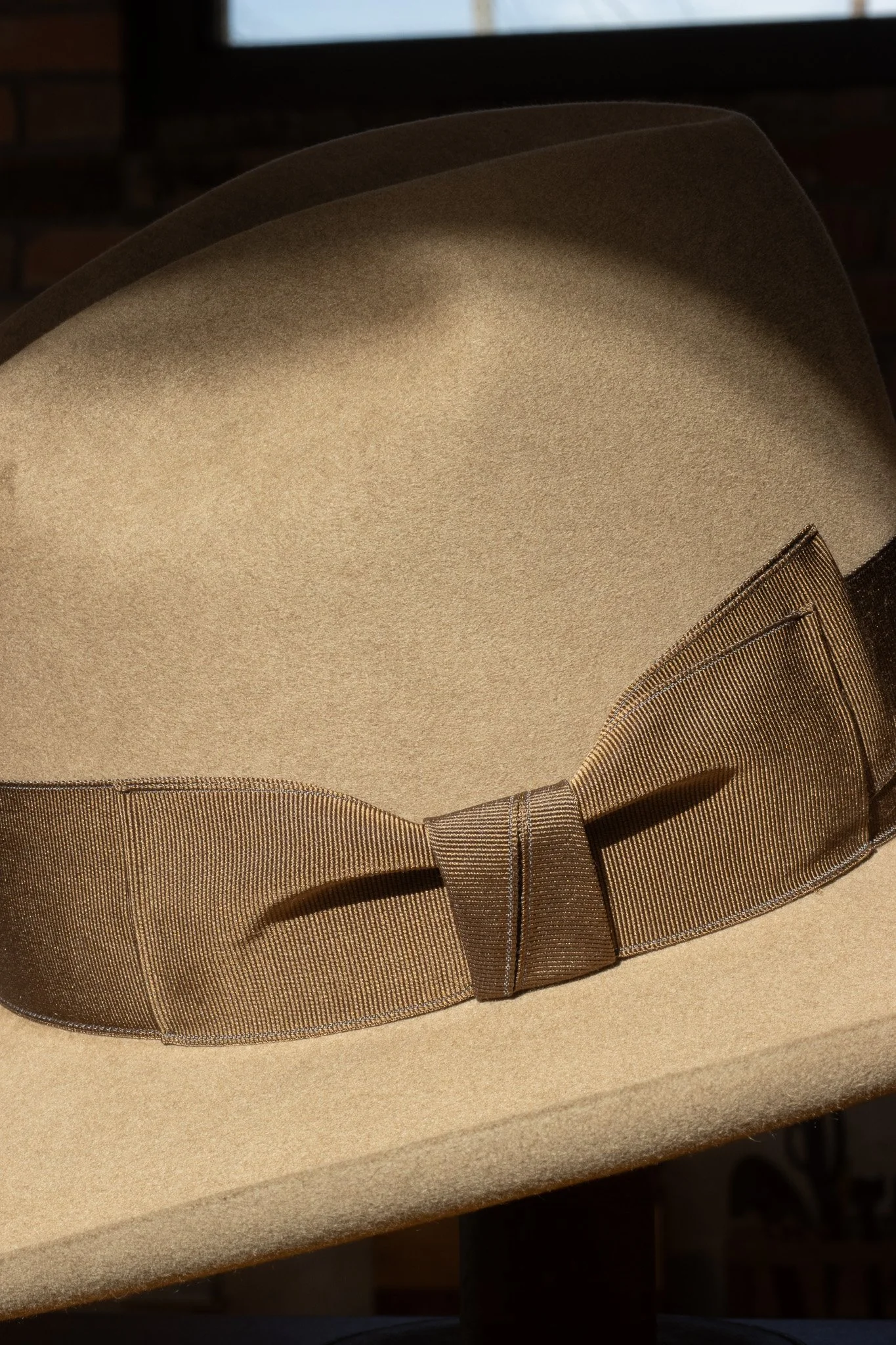 Natural felt colored Gus crown hat made by a true custom hatter in Dallas, Texas. Handmade hat store in Dallas Texas.